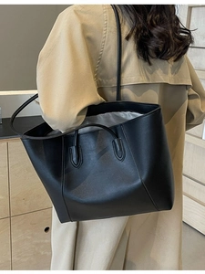 Minimalist black tote bag with shoulder strap and large capacity for daily commuting