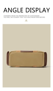 Detailed bottom view of large khaki canvas travel bag with brown leather reinforcement