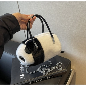 Detail of plush panda bag showing fluffy texture, faux fur, and silver chain strap