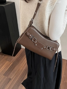 Deep brown faux leather baguette shoulder bag with silver buckles and moto-style studs