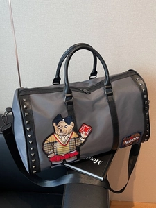 Grey duffel travel bag with cute bear embroidery and stylish silver rivet details
