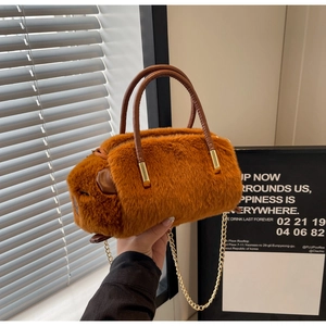Close-up of plush capybara handbag featuring soft long fur and golden chain strap
