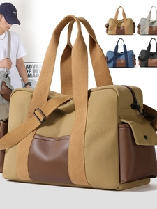 Large canvas travel duffel bag with leather trim, featuring adjustable straps and color options