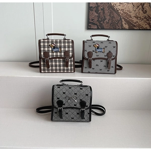 Three retro school-style square backpacks with checkered patterns and dog embroidery details