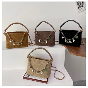 Quilted matte bucket bags in four colors featuring metal chain straps and charms