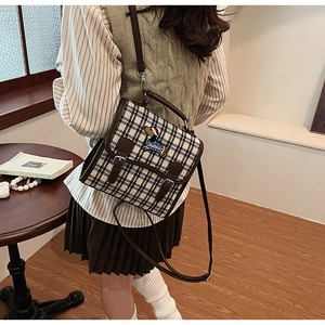 Detailed back view of a retro plaid canvas crossbody bag with a cute puppy embroidery