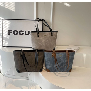 Three-piece tote bag set in grey, brown and blue with textured stone finish faux leather