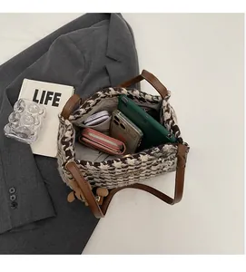 Top view of houndstooth tote bag interior showing large capacity for tablet and wallet