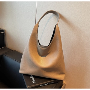 Chic khaki pebbled PU leather hobo shoulder bag for women shown in a lifestyle setting