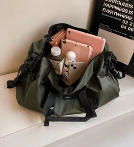 Deep green travel bag interior showing spacious capacity for tablets and essentials