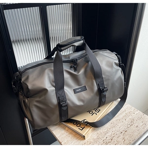 Close-up of waterproof Oxford fabric travel bag with reinforced handles and side pocket
