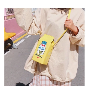 Detailed close-up of yellow banana milk carton crossbody bag with nutritional label print