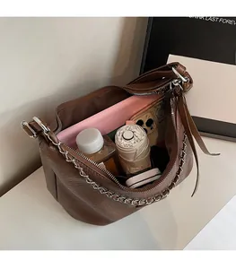 Top view of large capacity brown leather tote bag showing spacious interior with items