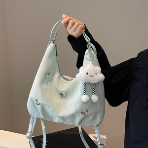 Mint green pleated shoulder bag with silver butterflies and cloud plush charm