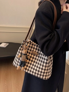 Classic houndstooth tote bag with brown leather straps and a cute rabbit charm