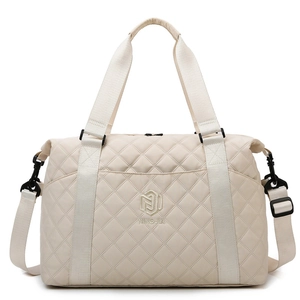 Quilted cream oxford travel bag with adjustable strap and front zipper pocket