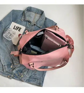 Detailed interior of a pink travel bag showing ample space for iPad and essentials