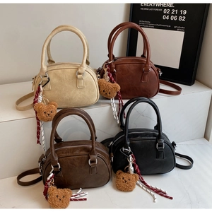 Collection of retro Boston handbags in four colors with cute teddy bear pendants