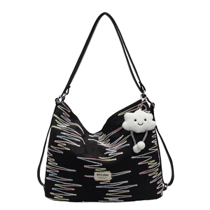 Versatile black tote backpack with colorful wave embroidery and cloud charm detail