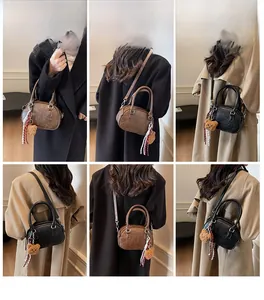 Multiple views of women's vintage mini boston bag shown with teddy bear charm on model