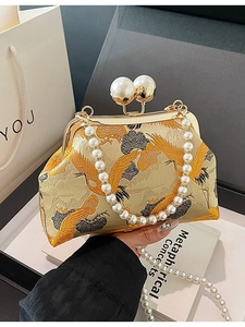 Elegant Chinese style gold satin evening bag with crane embroidery and pearl handle