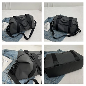 Detail view of large grey waterproof Oxford travel bag with reinforced straps and zippers