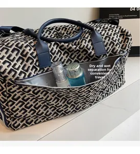Detail of wet and dry separation pocket on geometric pattern large travel bag