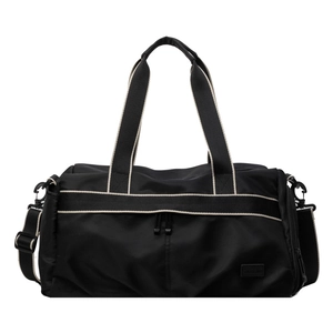 Black waterproof fitness travel bag with contrast beige straps and adjustable shoulder strap