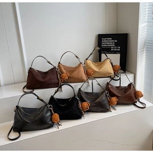 Variety of vintage PU leather crossbody bags with bear charms in earthy autumn tones