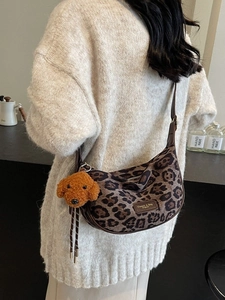 Fashionable leopard print half-moon crossbody bag with cute teddy dog charm