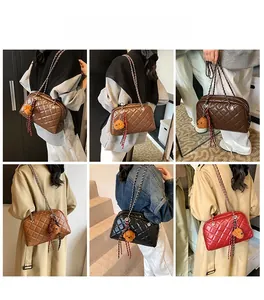 Lifestyle shots of model wearing the quilted chain pillow bag with plush charm