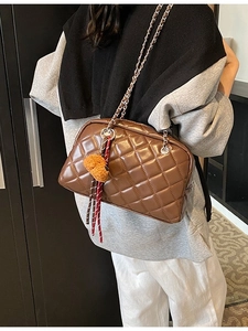 Brown quilted pillow bag with gold chain strap and cute teddy bear charm