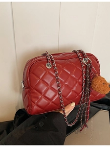 Red quilted pillow bag with silver chain and cute brown bear charm accessory
