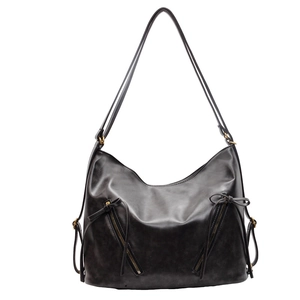Vintage black faux leather tote bag with large capacity and decorative bow tassels