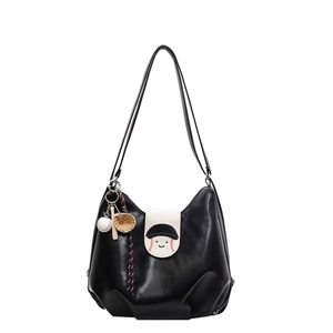 Large black shoulder tote bag with cartoon smiley face and baseball keychain charm