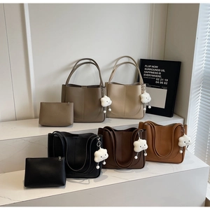 Litchi pattern bucket bags in five colors with matching pouches and plush cloud charms