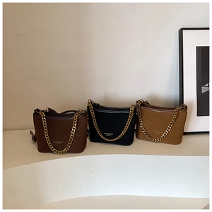 Three retro crossbody bucket bags with matte leather and bold gold chain straps