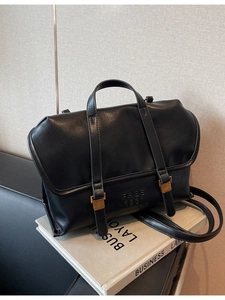 Versatile black leather tote bag with vintage straps and gold metal buckles for women