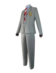 Detail van het grijze schooluniform met blazer, embleem, blauw overhemd en das
