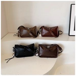 Variety of leather crossbody bags in black, dark coffee, reddish brown and tan colors