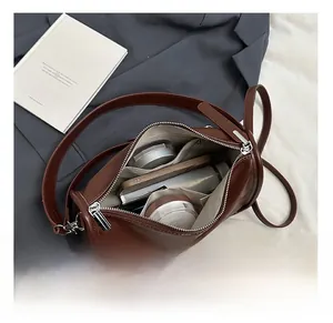 Internal view of the brown leather boston bag showing spacious compartments and storage