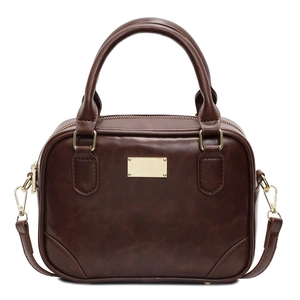 Dark brown retro box-shaped leather handbag with gold hardware and adjustable strap