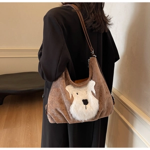 Brown corduroy tote bag featuring a cute white plush puppy patch and leather straps