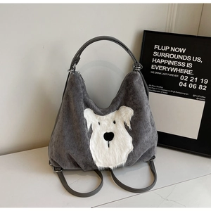 Detail of grey corduroy tote bag featuring a cute white plush puppy applique embroidery