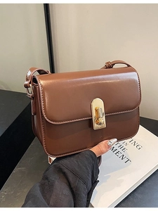 Classic vintage brown leather crossbody bag with gold buckle clasp for women