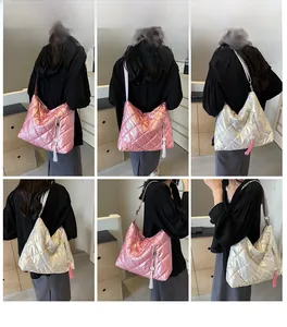 Detailed views of quilted metallic shoulder bag with tassel charm and zip pocket