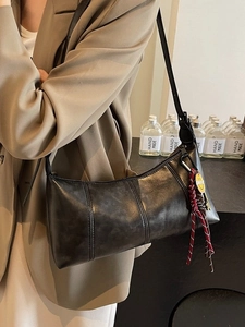 Retro black matte leather underarm bag with smiley charm and adjustable shoulder strap