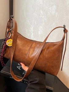 Vintage brown PU leather underarm bag with adjustable strap and smiley pendant