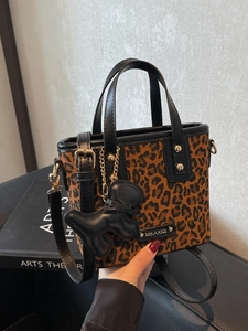 Sac Bandoulière Vintage Imprimé Léopard en Cuir PU Petit Sac Seau Femme Mode Sac à Main Polyvalent Avec Pendentif Animal