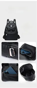 Detail view of black pebble leather backpack with multiple zip pockets and internal storage